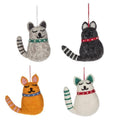 Four felt wool smiling cat ornaments in grey tabby, black, orange, and white styles with dotted collars and striped tails, from The Ruddy Duck in Whitefish, Montana