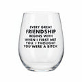 Clear wine glass with humorous text on a white background