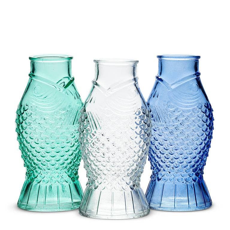 Small fish shaped glass bud vases in green, clear, and blue, from The Ruddy Duck in Whitefish, Montana