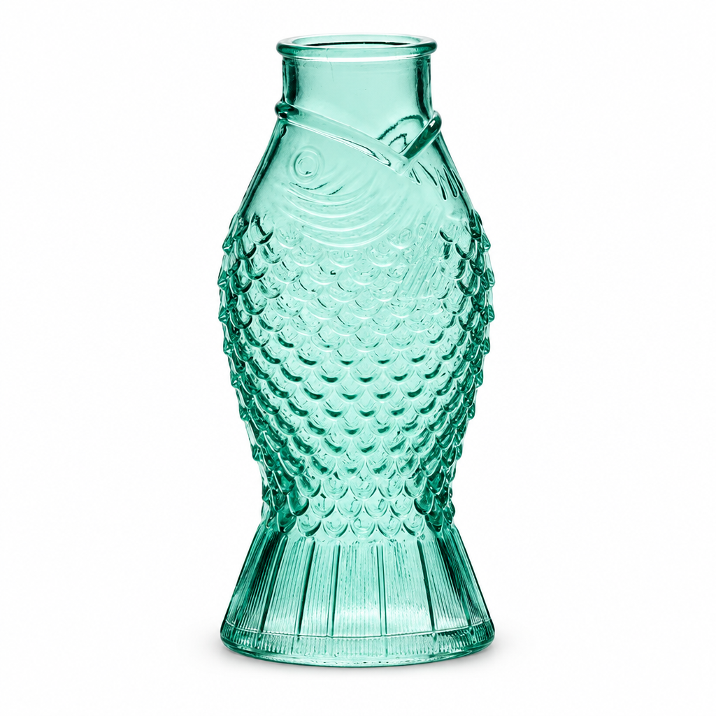 Small fish shaped glass bud vases in green, clear, and blue, from The Ruddy Duck in Whitefish, Montana