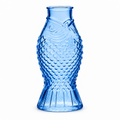Small fish shaped glass bud vases in green, clear, and blue, from The Ruddy Duck in Whitefish, Montana