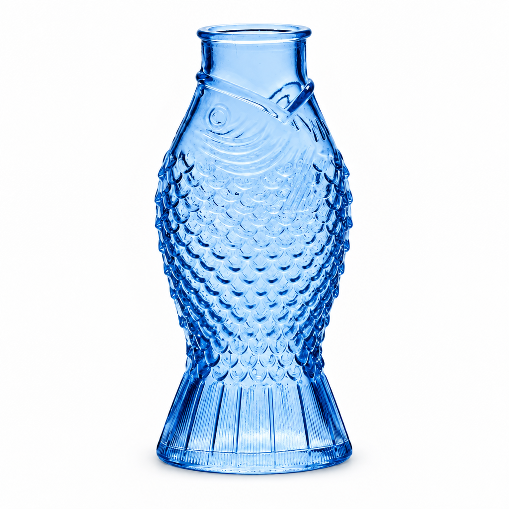 Small fish shaped glass bud vases in green, clear, and blue, from The Ruddy Duck in Whitefish, Montana