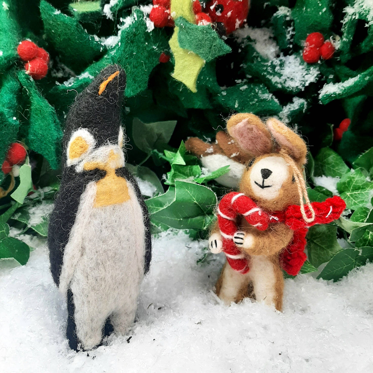 Handmade felt bunny Christmas ornament with knitted scarf and candy cane, from The Ruddy Duck in Whitefish, Montana