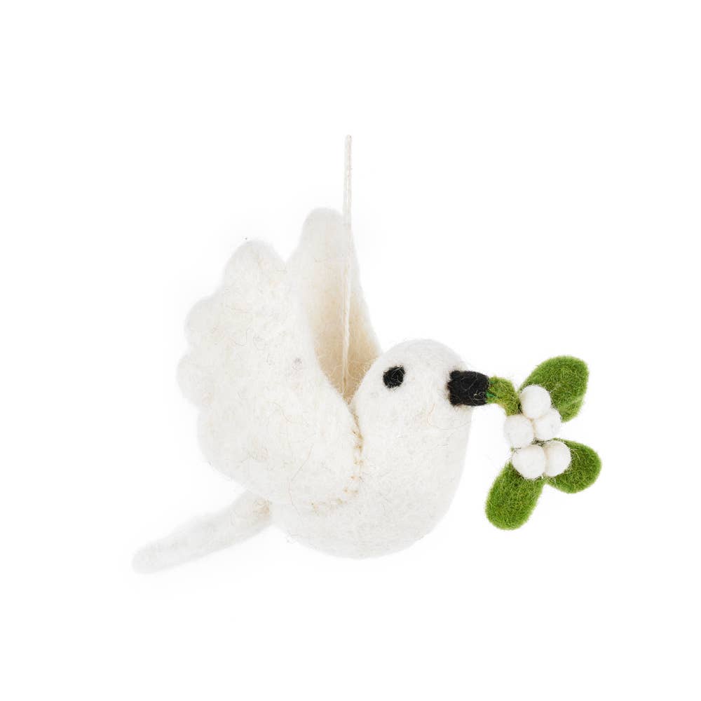 Handmade white felt dove Christmas ornament carrying mistletoe sprig, from The Ruddy Duck in Whitefish, Montana
