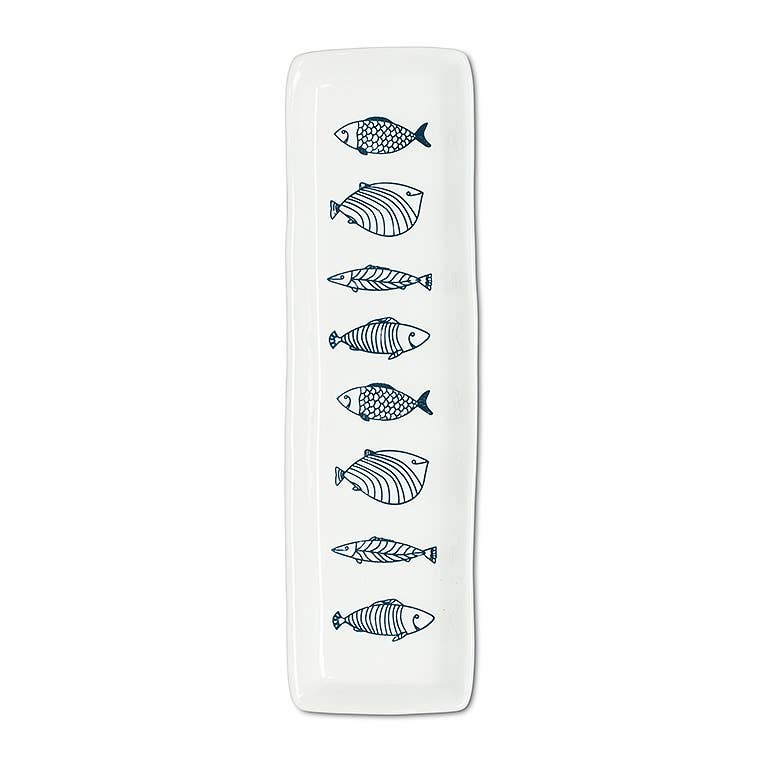Long white stoneware serving plate with blue line-drawn fish, from The Ruddy Duck in Whitefish, Montana