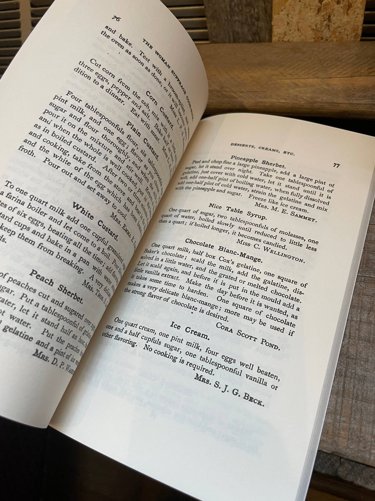 Open book showing dessert recipes including sherbets, custards, and ice cream