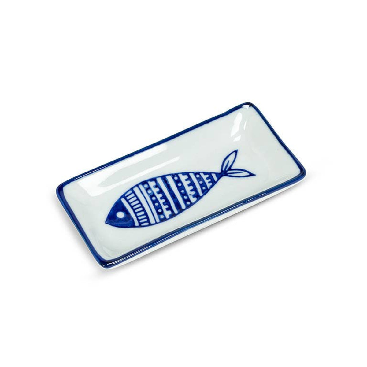 White porcelain sauce dish with blue fish design and blue trim, from The Ruddy Duck in Whitefish, Montana