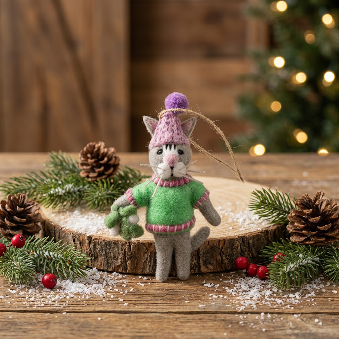 Handmade felt cat Christmas ornament in neon green sweater and pink bobble hat with mistletoe, from The Ruddy Duck in Whitefish, Montana