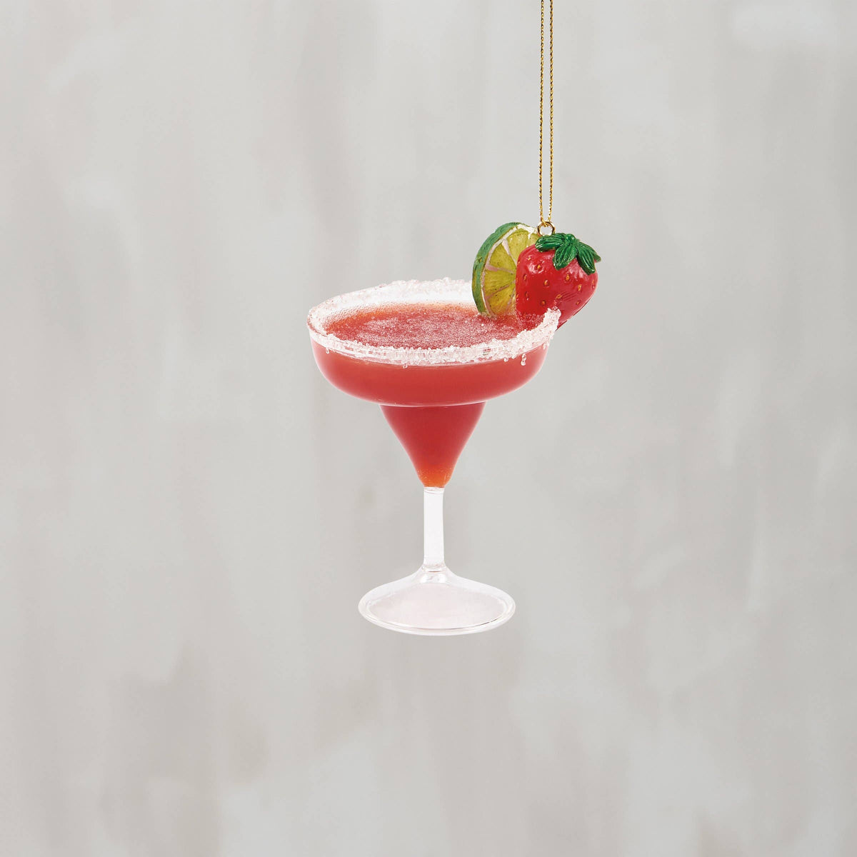 Glass strawberry margarita ornament in bright red with sugared rim, lime slice, and strawberry garnish, from The Ruddy Duck in Whitefish, Montana