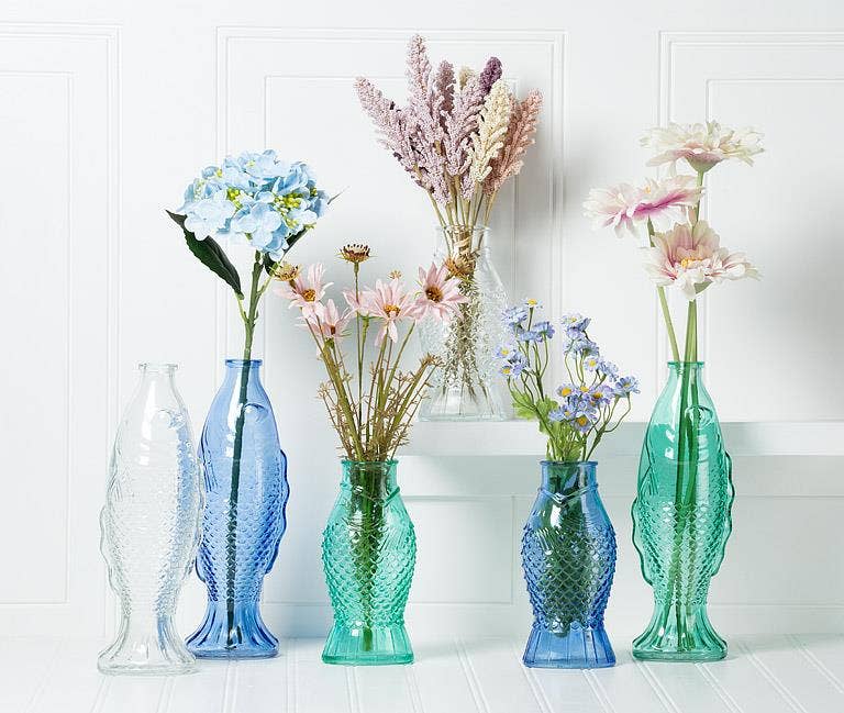 Small fish shaped glass bud vase with molded scales, from The Ruddy Duck in Whitefish, Montana