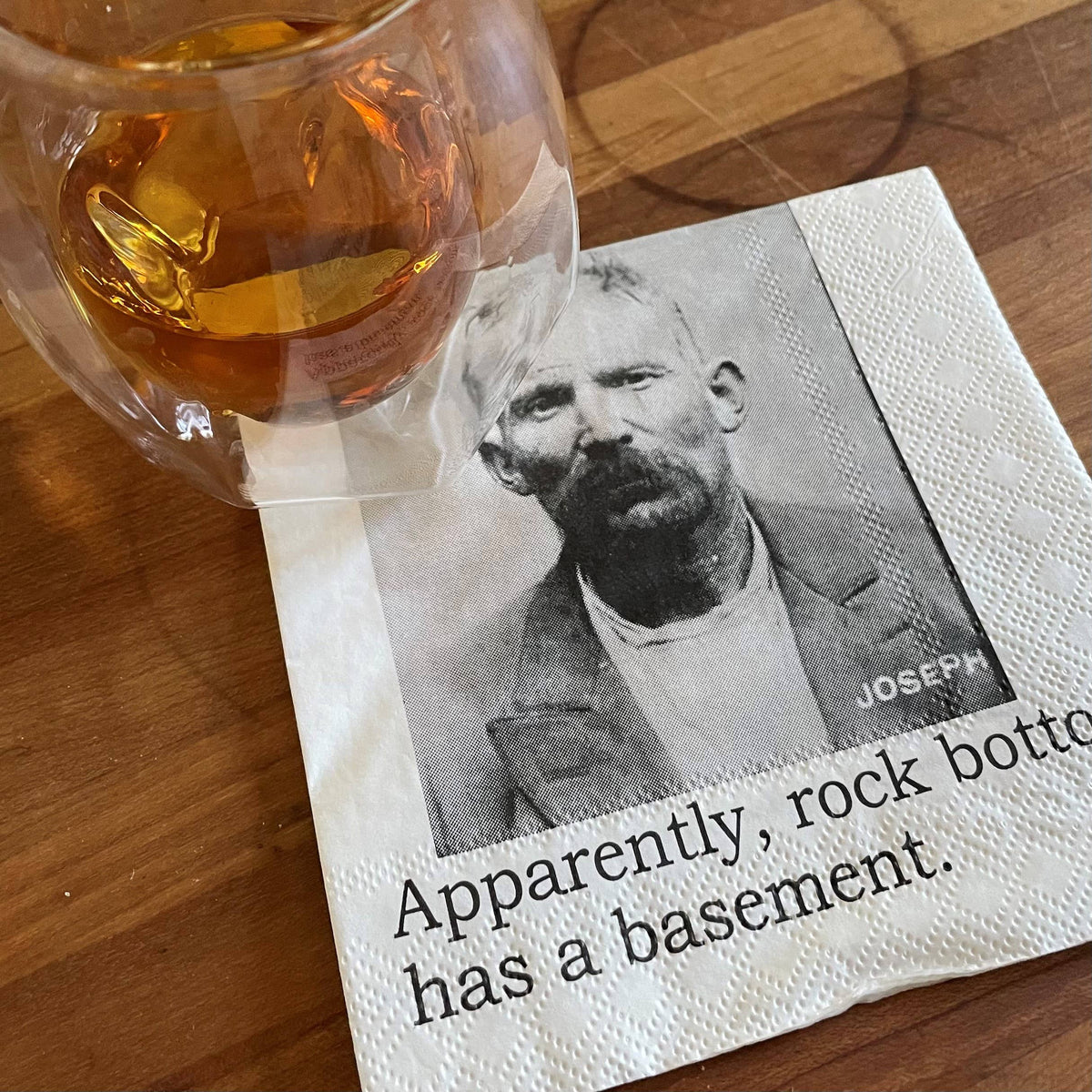 Rock Bottom Has a Basement funny mugshot cocktail napkins, pack of 20, from The Ruddy Duck in Whitefish, Montana