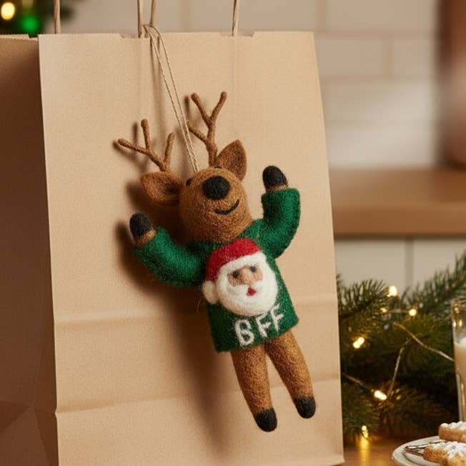 Handmade felt reindeer Christmas ornament in green BFF sweater with Santa face, from The Ruddy Duck in Whitefish, Montana
