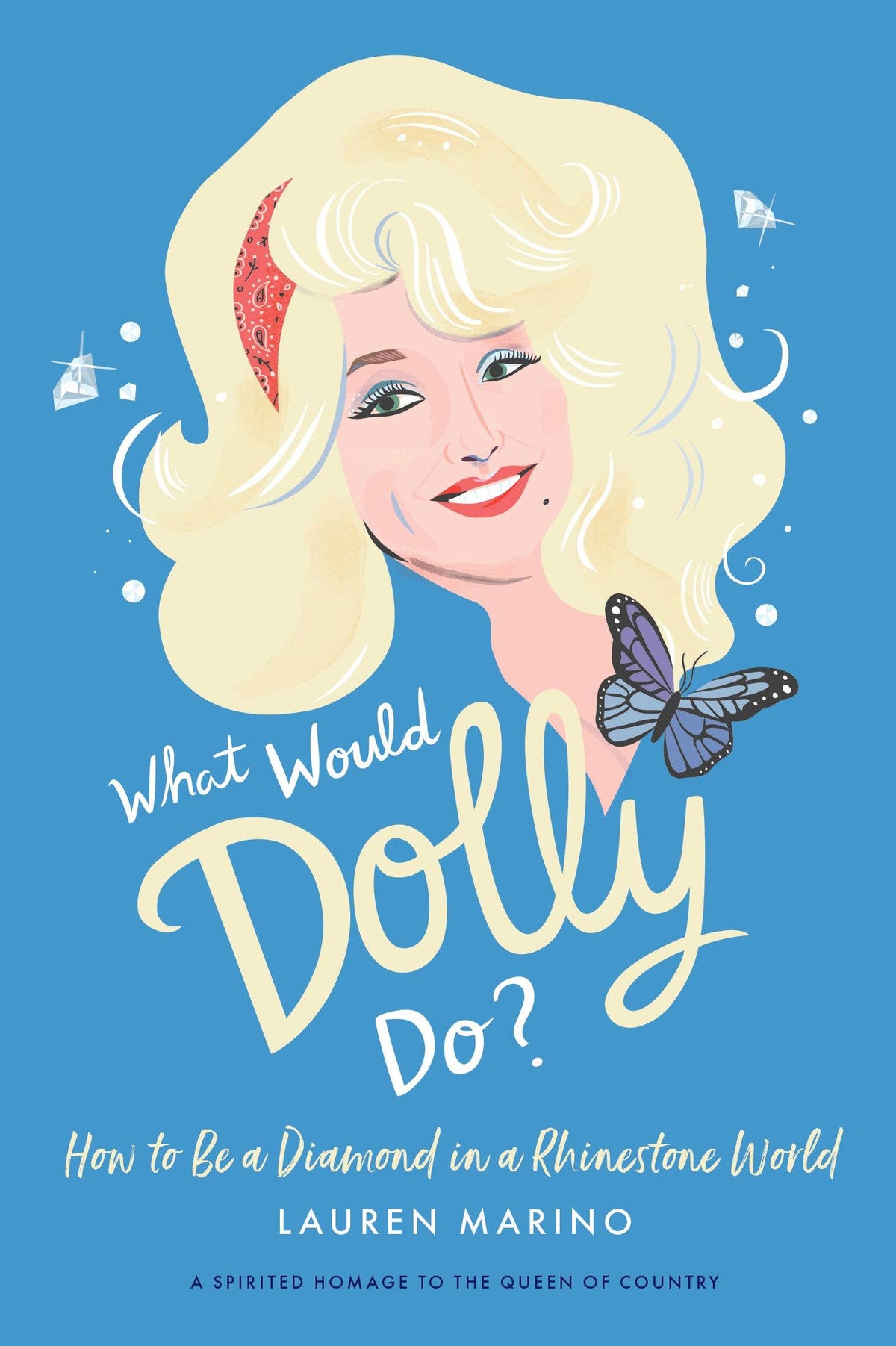 What Would Dolly Do? illustrated hardcover book with a sky blue cover featuring a portrait of Dolly Parton with a butterfly and diamonds, from The Ruddy Duck in Whitefish, Montana