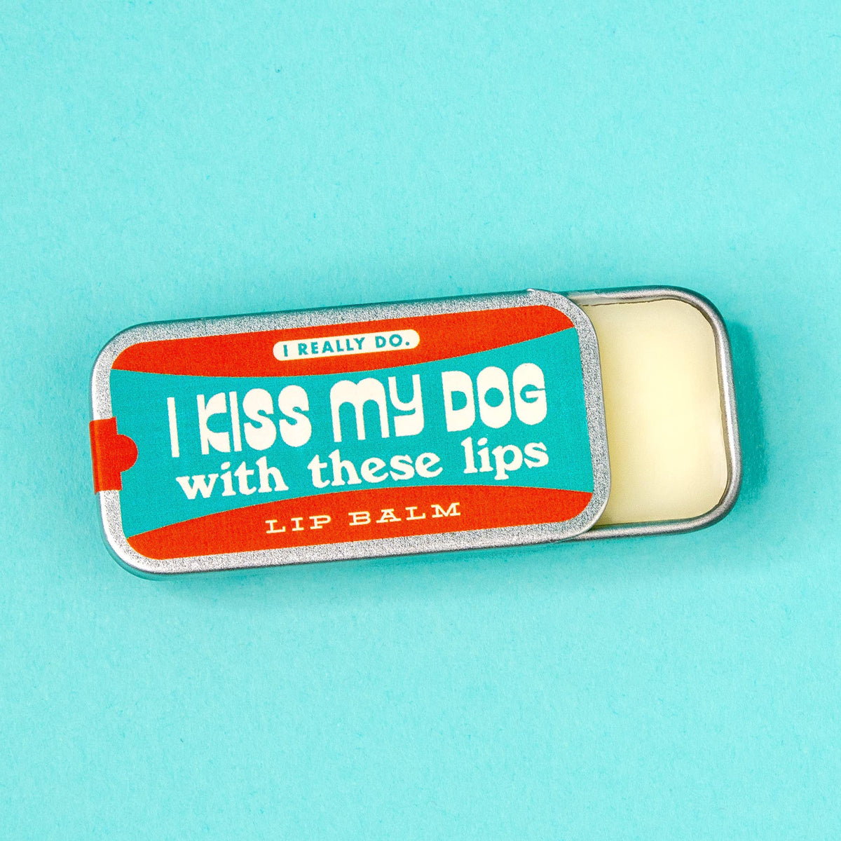 I Kiss My Dog vanilla lip balm in an old school metal tin by Whiskey River Soap Co., from The Ruddy Duck in Whitefish, Montana