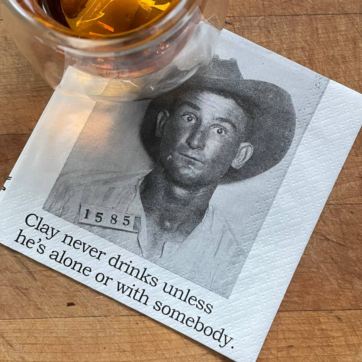Clay Never Drinks Alone funny mugshot cocktail napkins, pack of 20, from The Ruddy Duck in Whitefish, Montana