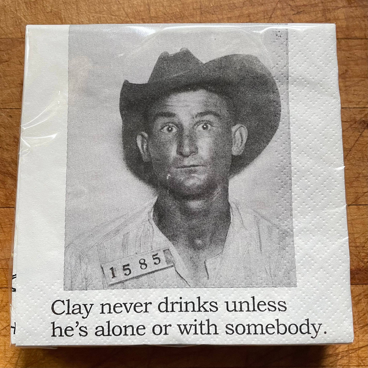 Clay Never Drinks Alone funny mugshot cocktail napkins, pack of 20, from The Ruddy Duck in Whitefish, Montana
