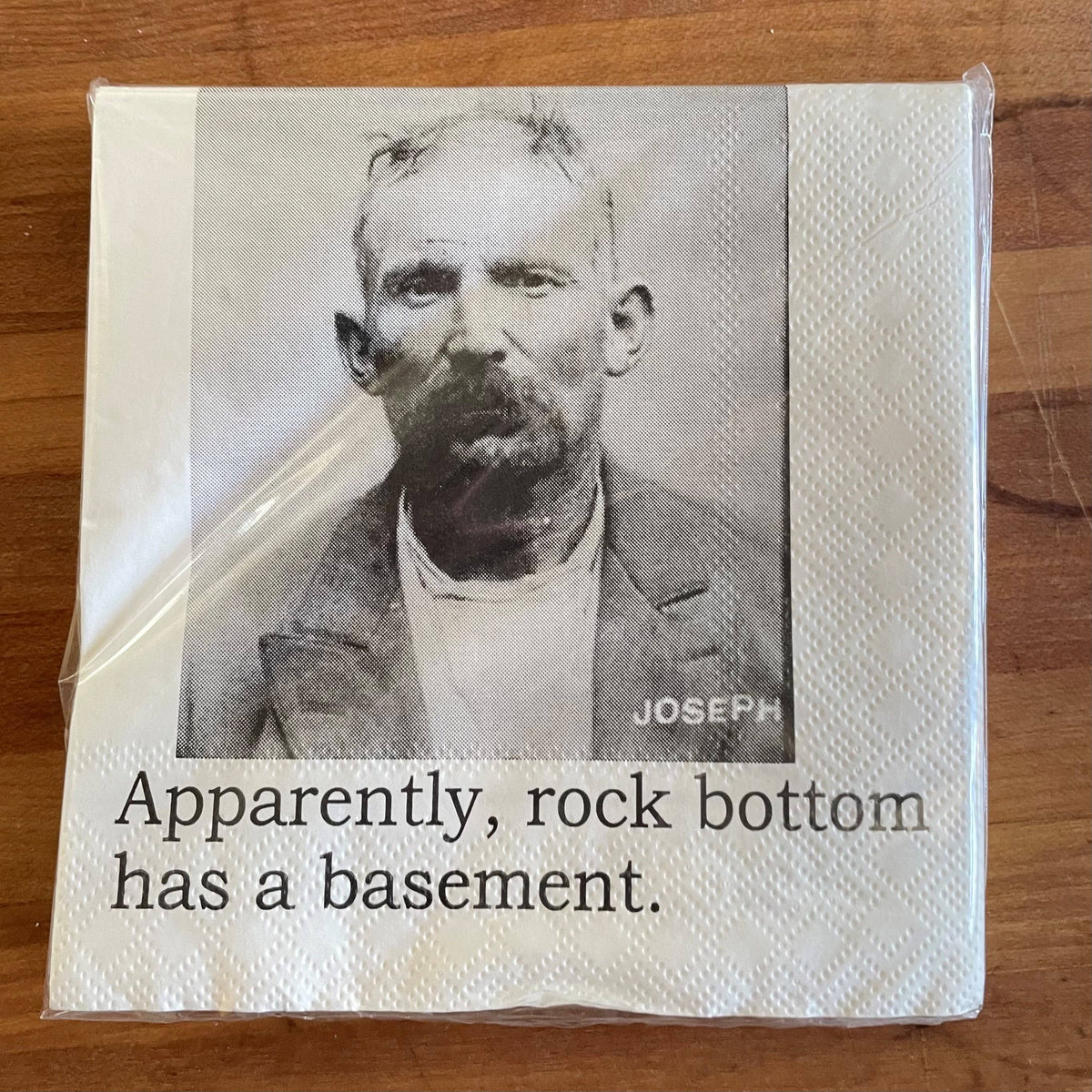 Rock Bottom Has a Basement funny mugshot cocktail napkins, pack of 20, from The Ruddy Duck in Whitefish, Montana