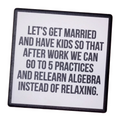 Coaster with humorous text about marriage and children on a wooden surface