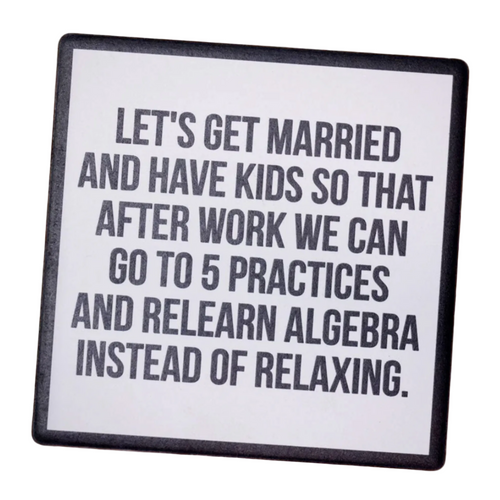 Coaster with humorous text about marriage and children on a wooden surface