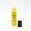 Small bottle of Amla Oil on a reflective surface