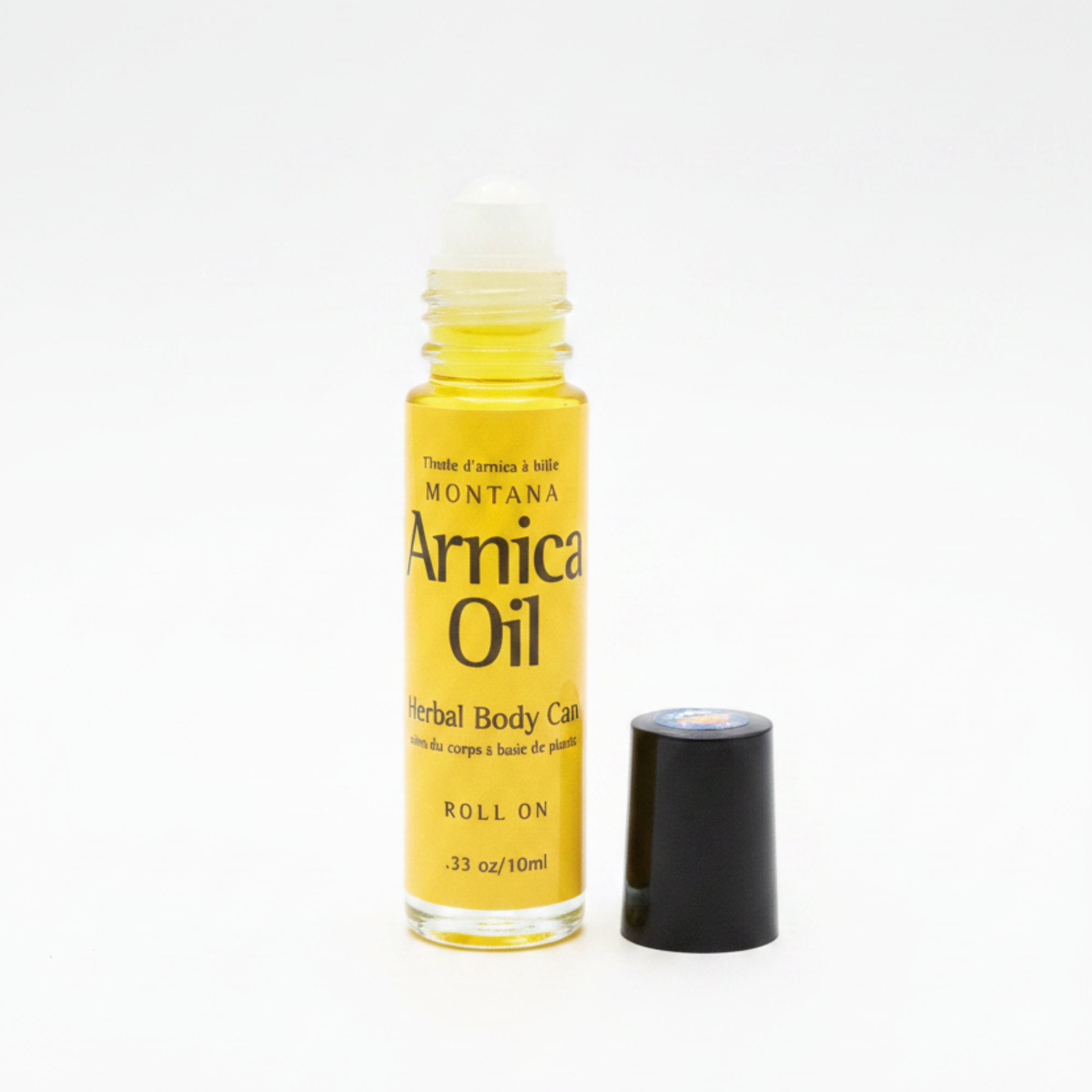 Small bottle of Amla Oil on a reflective surface