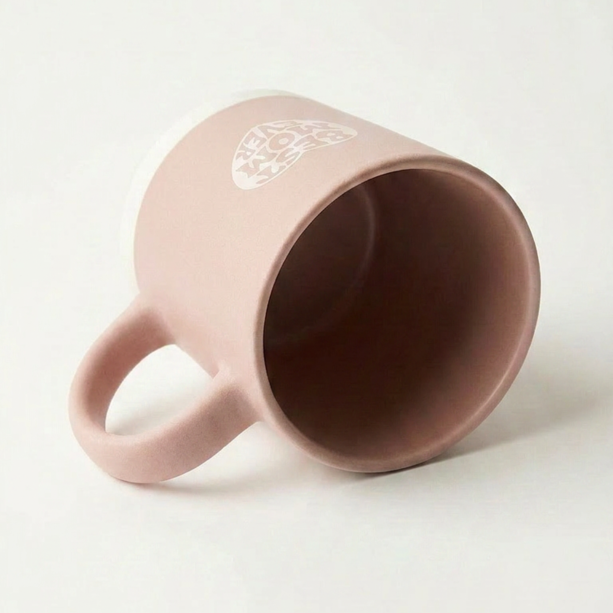 Pink mug with text on a white background