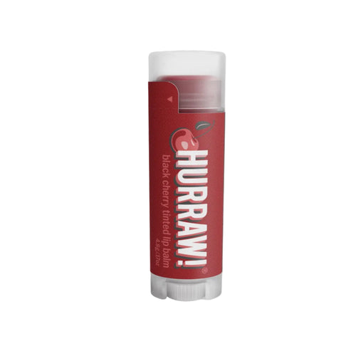 Red Hurraw! lip balm tube on a white background