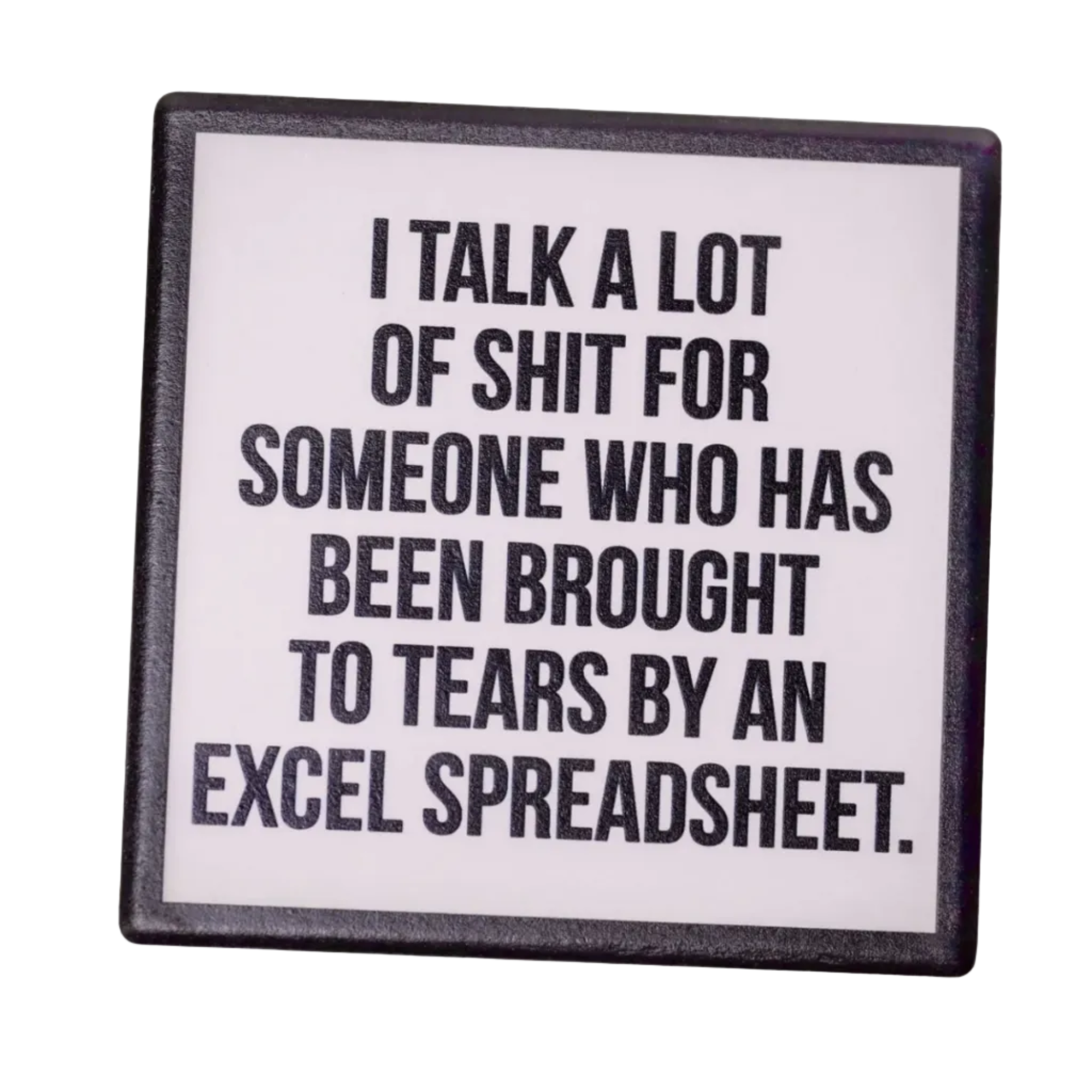 Coaster with humorous text on a wooden surface