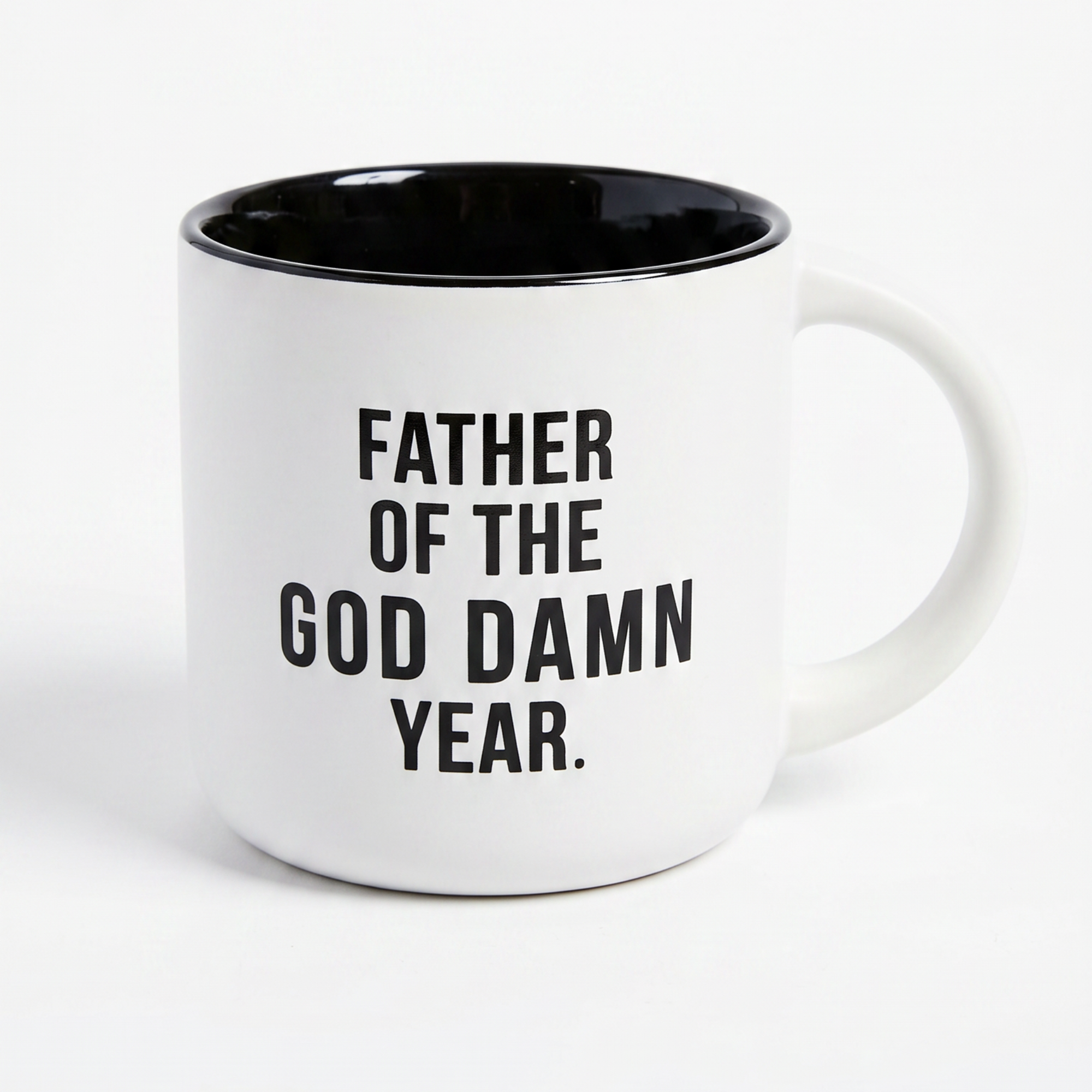 White mug with black interior and handle, featuring text on a white background