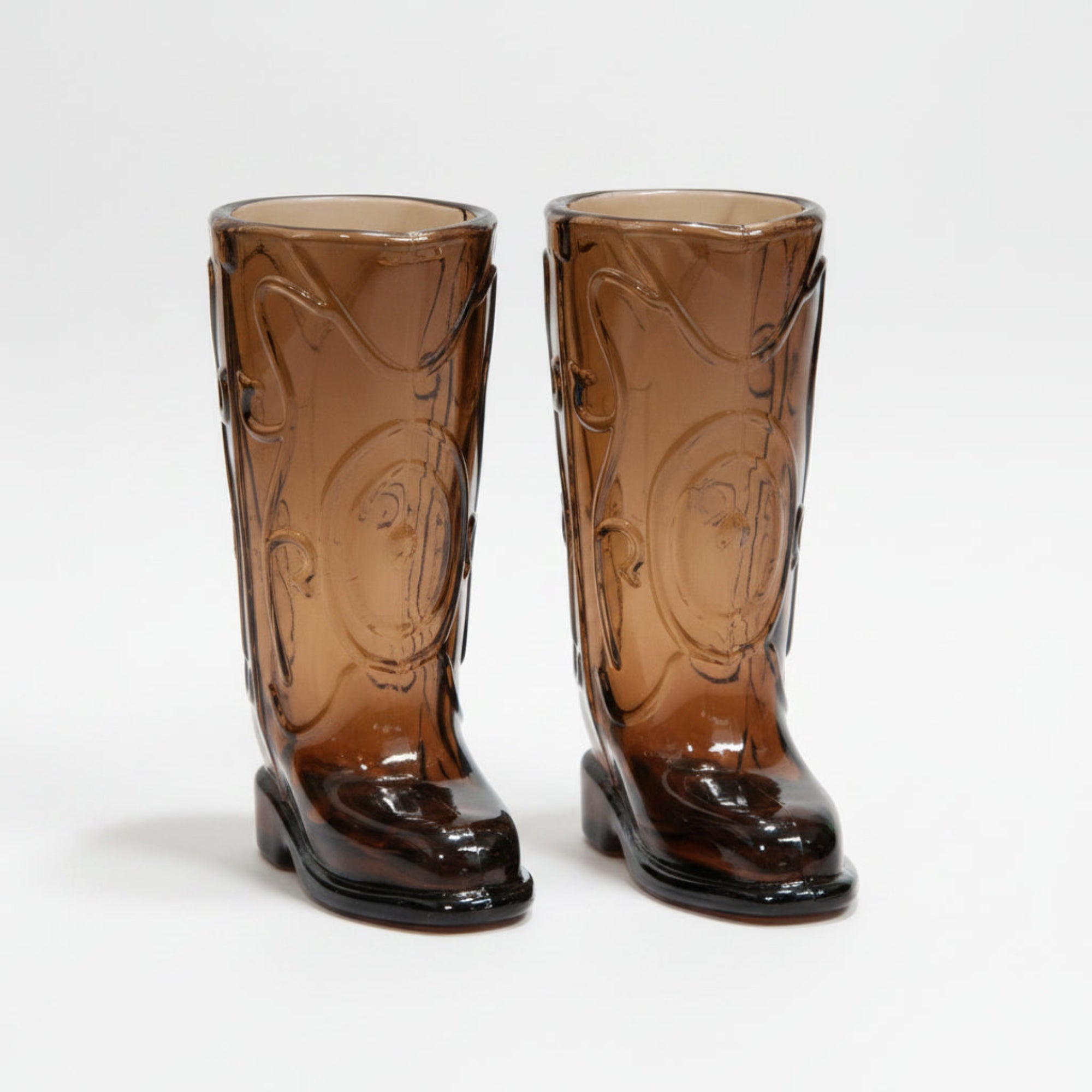 Pair of brown glass cowboy boot shot glasses