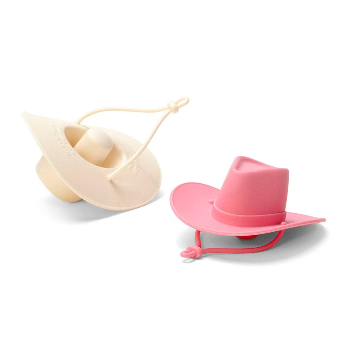 Two silicone cowboy hat-shaped bottle stoppers, one in cream and one in pink, displayed on a clean white background.