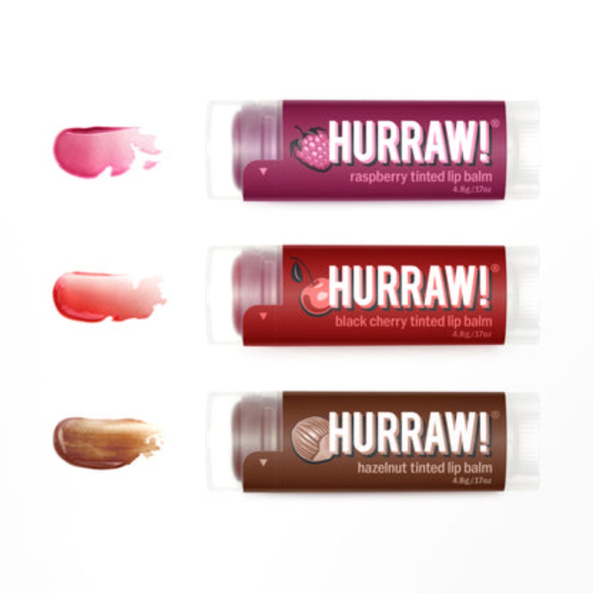 Three Hurraw! lip balm tubes with different flavors on a white background