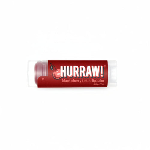 Hurraw! black cherry tinted lip balm on a white background