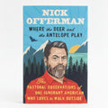 Book titled 'Where the Deer and the Antelope Play' by Nick Offerman on a wooden surface.