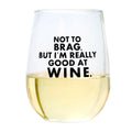 Stemless wine glass with text 'Not to brag, but I'm really good at wine' on a white background