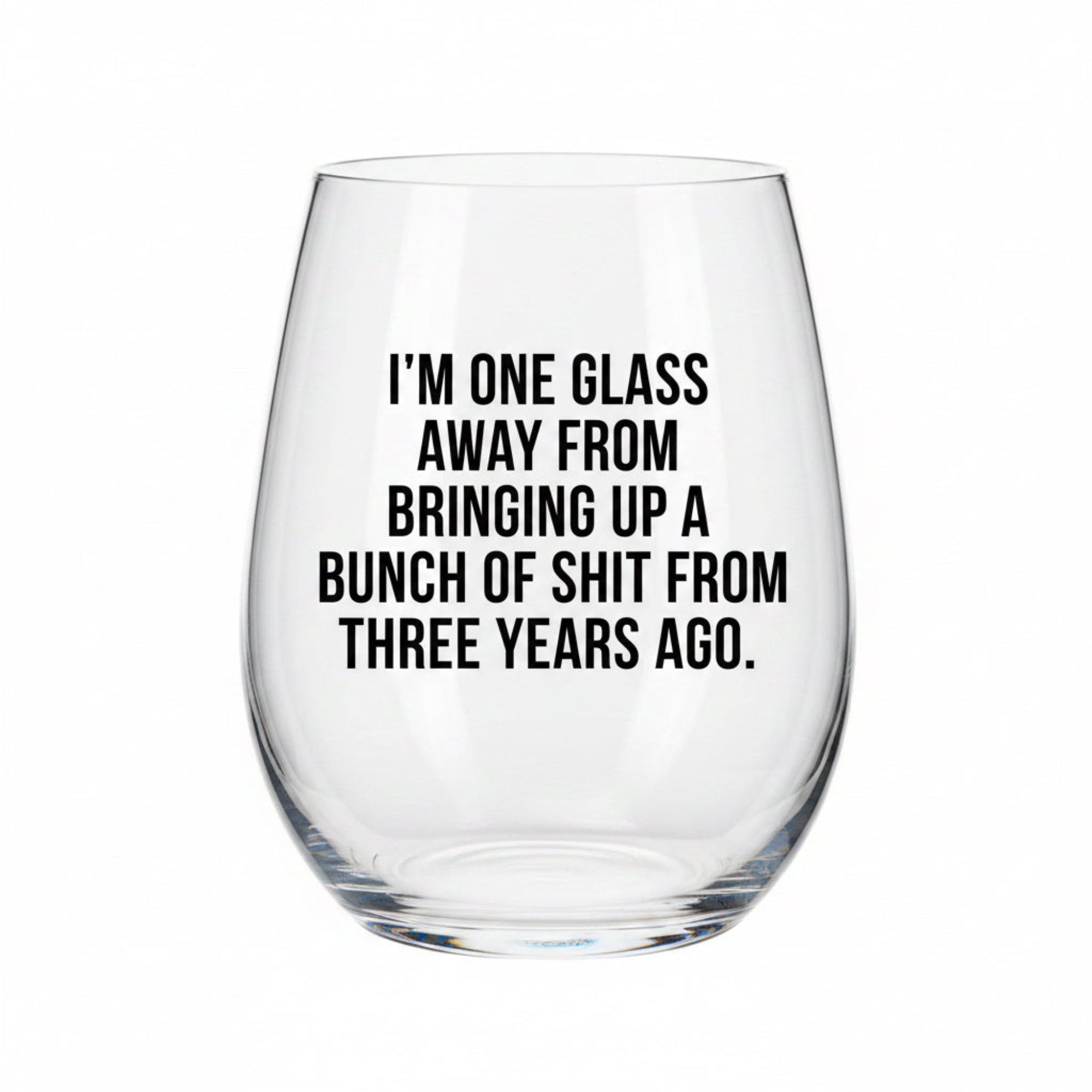 Clear wine glass with humorous text on a white background
