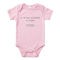 Pink baby onesie that says I'm Not Allowed to Date. Ever. in gray typewriter lettering, from The Ruddy Duck in Whitefish, Montana