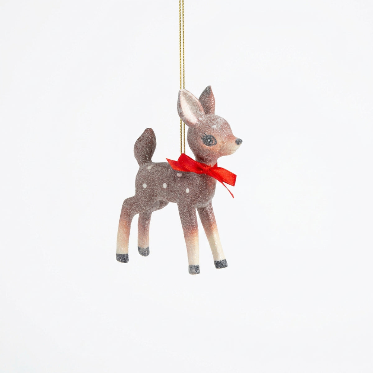 Retro glittered standing fawn deer ornament in soft brown with white spots and a red bow, from The Ruddy Duck in Whitefish, Montana