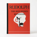 Rudolph the Red-Nosed Reindeer 1939 facsimile book cover, bright red with a Rudolph illustration, from The Ruddy Duck in Whitefish, Montana