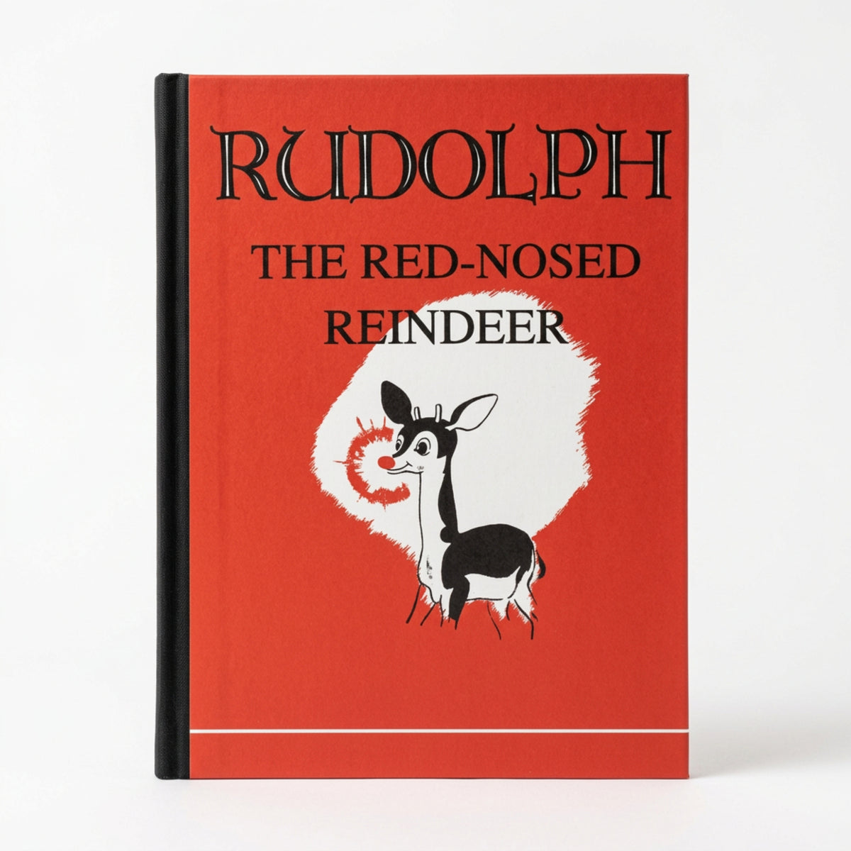 Rudolph the Red-Nosed Reindeer 1939 facsimile book cover, bright red with a Rudolph illustration, from The Ruddy Duck in Whitefish, Montana
