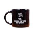 Black mug with white text on a white background