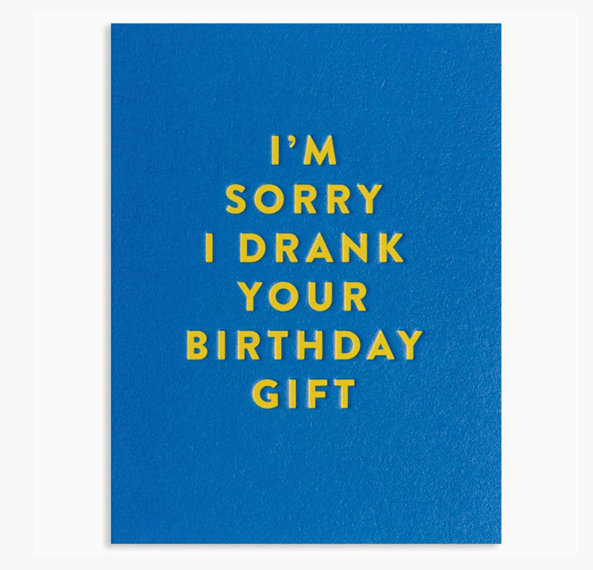 Blue card with yellow text 'I'm sorry I drank your birthday gift' on a white background