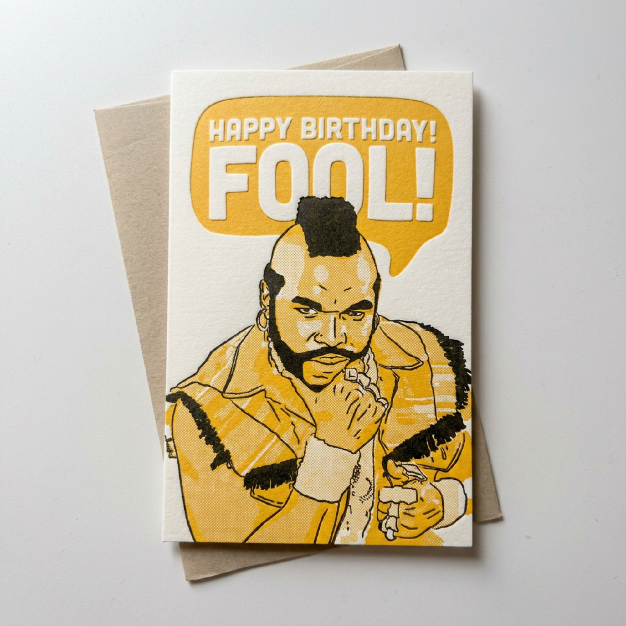 Birthday card with illustration of a character and 'Happy Birthday Fool!' text on a light gray background