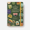Book titled 'The National Parks Traveler's Companion' with various travel-themed illustrations on a green background.