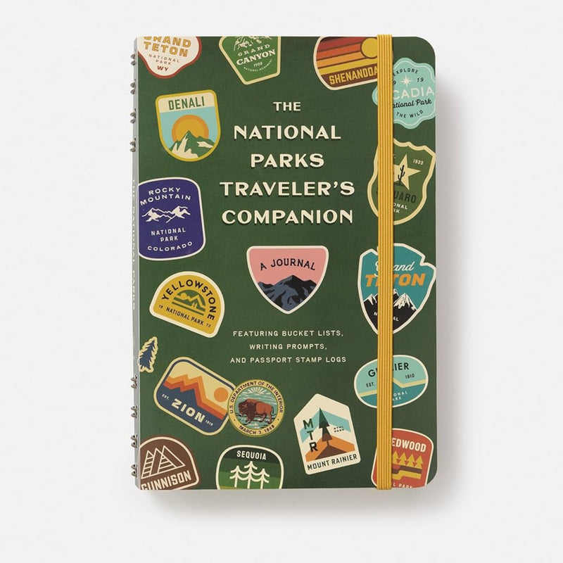 Book titled 'The National Parks Traveler's Companion' with various travel-themed illustrations on a green background.