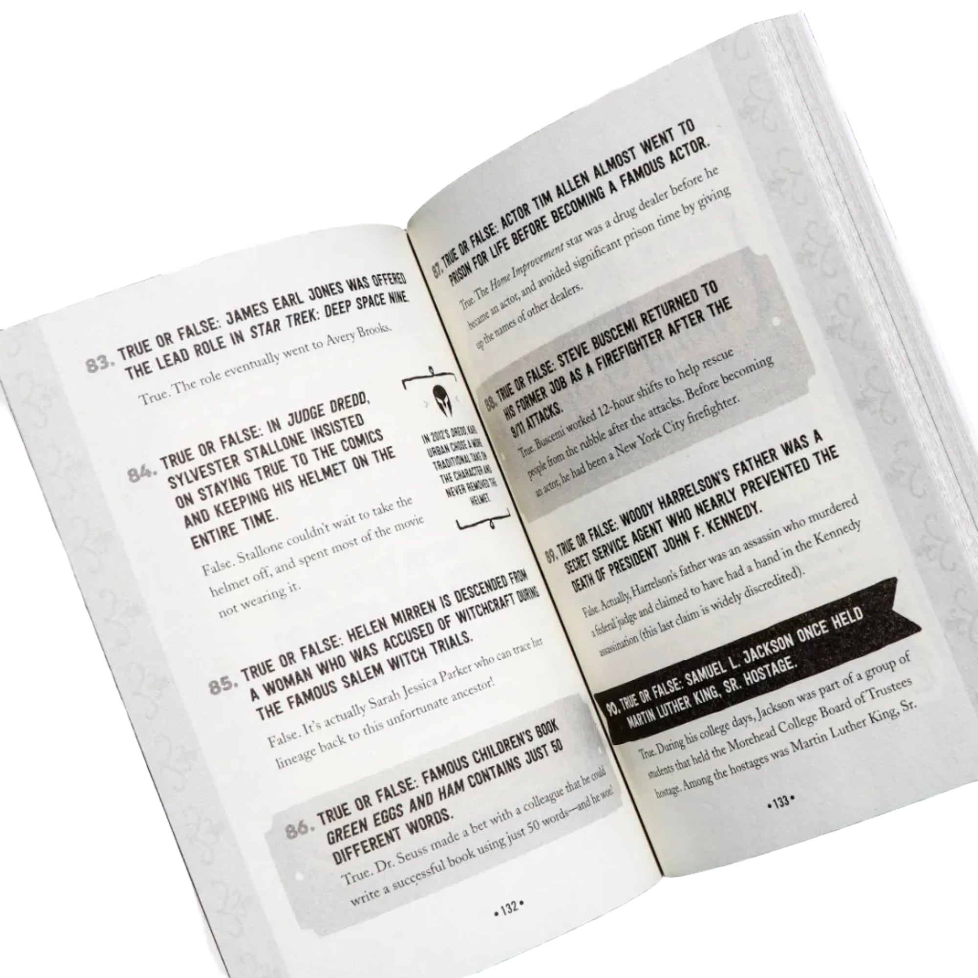 Open book with text and two small bottles on a dark background