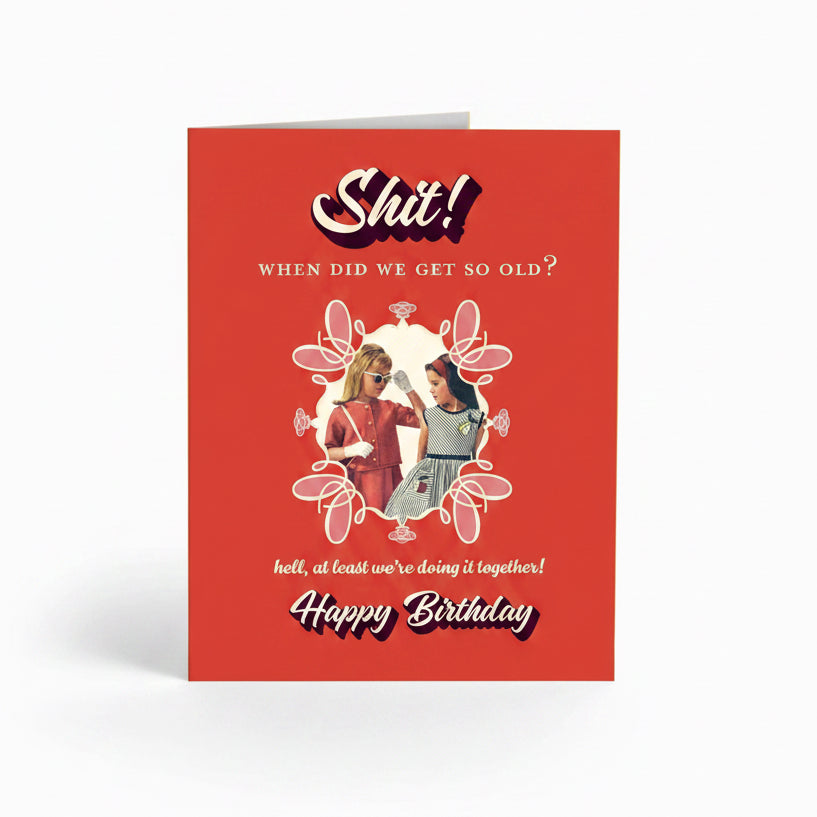 Birthday card with illustration of two people and humorous text on a red background