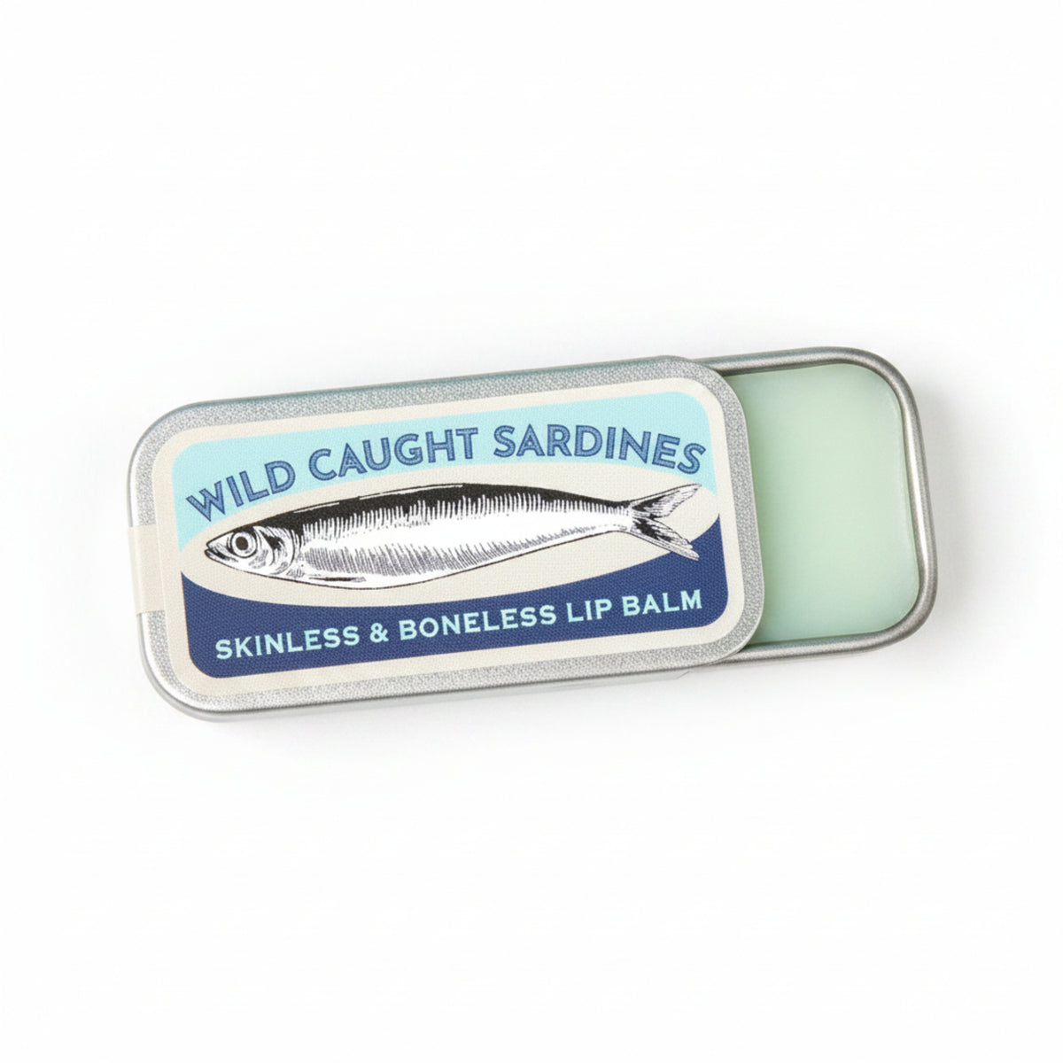 A silver metal tin of 'Wild Caught Sardines' lip balm, partially open to reveal the pale green balm inside, set against a solid light turquoise background.