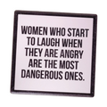 Ceramic Coaster with text 'Women who start to laugh when they are angry are the most dangerous ones' on a wooden surface.