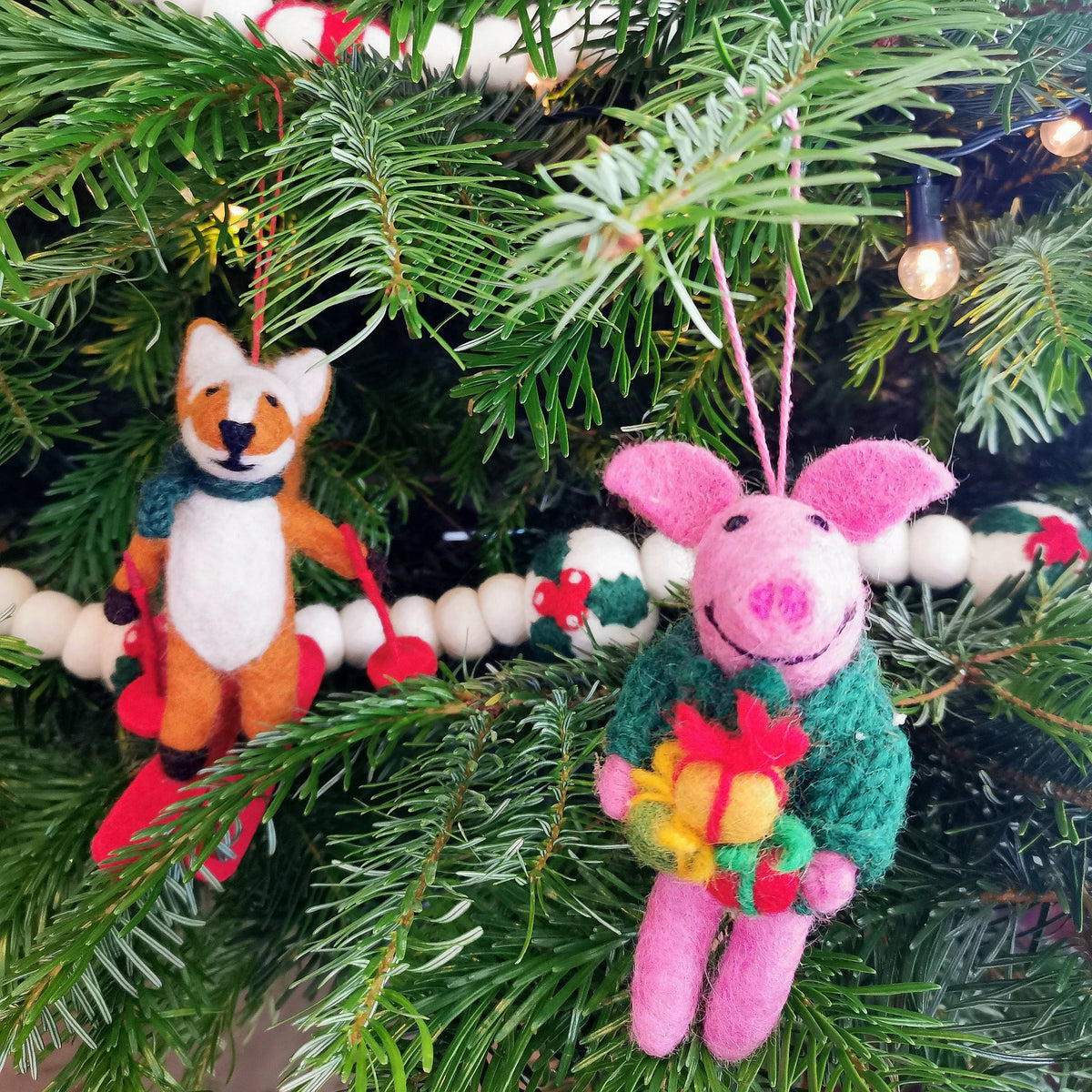 Handmade felt fox Christmas ornament on wet felted skis, from The Ruddy Duck in Whitefish, Montana